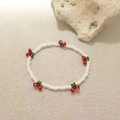 Detailed view of handmade beaded cherry bracelet with white, red and green crystals - White Crystal Cherry Bracelet