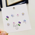 Detail of 925 silver tulip and butterfly stud earrings set on a white display card - Butterfly Flower Tulip Set / Purple