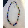 Detail of colorful millefiori glass bead necklace with silver lobster clasp and chain - Multicolor Lampwork Necklace
