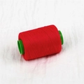 Single roll of vibrant red sewing thread on a green plastic spool for DIY handmade crafts - About 300 Meters / Rose Red