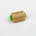 Golden brown sewing thread spool on green plastic core for DIY hand stitching - About 300 Meters / Beige
