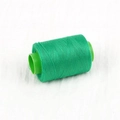 Single spool of vibrant emerald green sewing thread with a matching green plastic core - About 300 Meters / Vegetable Green