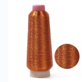 Metallic orange computer embroidery thread spool with zoomed-in texture detail - Copper