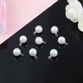 Macro shot of 8-piece set white round ABS pearl pendants with silver metal loops and caps - 10 Pieces/Pack (1.5mm Hole) / Silver Tone & White Artificial Pearl (8mm)