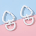 Two white heart-shaped alloy spring clasps with D-ring connectors for DIY keychain making - White