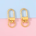 Pair of polished gold lobster claw clasps for DIY jewelry and bag hardware - Gold
