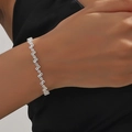 Macro detail of a silver zircon bracelet featuring irregular crushed ice cut geometric stones - 单排镶钻手链