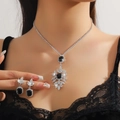 Detail of silver necklace and earrings set with black rectangular gems and crystals - Black 208-Square Snowflake