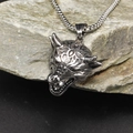 Macro detail of vintage wolf head pendant in distressed steel on a textured grey stone - Steel Color Pendant (HT-3733) / Pendant Only (Without Chain)