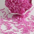 Translucent pink glass bugle beads in a ceramic bowl for DIY jewelry making - 15g/Pack (Approx. 300 Pcs) / Rose Red