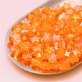 Iridescent orange star acrylic beads for DIY jewelry making displayed on a silver tray - Star Style / 100 Pieces Pack (11x10mm) / Iridescent Orange