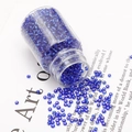 Transparent dark blue glass seed beads in a clear bottle for DIY jewelry making - Sapphire Blue