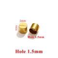 Macro shot of 2mm gold stainless steel cord end caps with 1.5mm hole dimensions - Inner 1.5mm / Gold