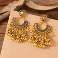Detail of bohemian gold-finish tassel earrings with filigree pattern and metal bells - Gear Shaped Round Ornament (WEH6072) / Antique Gold