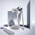 Macro detail of a high heel brooch featuring sparkling rhinestones and a delicate bow knot - Silver White (WBR340)