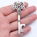 Antique silver key-shaped bottle opener pendant with intricate vintage hollow patterns - Antique Silver