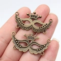 Pair of antique bronze crown mask alloy charms for DIY jewelry making and crafts - Antique Bronze