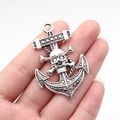 Gothic anchor skull pendant in vintage silver alloy held by hand to show 54x36mm size - Ancient Silver (B17945)