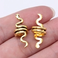 Pair of gold snake-shaped spiral hair braid rings and ear cuffs in a polished alloy finish - Antique Gold