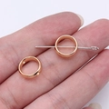 Rose gold circular spacer beads for jewelry making shown with a pin for size reference - KC Gold