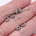 Retro silver gear-shaped alloy spacer beads for DIY jewelry making on a hand - Antique Silver