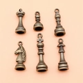 Antique bronze chess piece charms set featuring king queen knight rook bishop and pawn - Antique Bronze