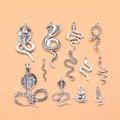Set of 12 vintage silver snake charms in various artistic designs for jewelry making - Antique Silver