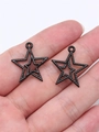 Two black electrophoretic star charms with hollow design held in hand for size comparison - Hollow Double Layer Star (D11805)