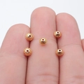 Five gold double-sided carved conical spacer beads for DIY jewelry making on a finger - KC Gold (D12105_W15-X18)