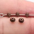 Antique copper spacers with double-sided carving and radial ribbed texture - Antique Red Copper (D12905_W33-D45)