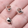 Three mini vintage silver cup pendants for DIY jewelry making displayed on a palm - Cup Shaped (B16867) / 8x11x5mm / Antique Silver