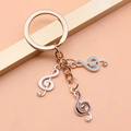 DIY gold alloy keychain with musical G-clef charms in white, blue, and black colors - Beautiful Music Note Style (XY30092)
