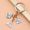 Golden keychain with blue mosaic geometric charms including circle and square pendants - Geometric Grid Style (XY30094)
