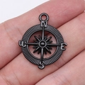 Gothic compass charm in matte black alloy featuring N/E/S/W letters and cross detail - Compass (D11815_24x29mm)