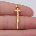 Miniature syringe charm in matte gold finish with realistic scale details for DIY jewelry - KC Gold