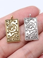Silver tarot pendant featuring 'THE MOON' embossed design held in palm for scale - The Moon (THE MOON) / Antique Gold
