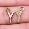 Vintage bronze letter Y charms for jewelry making shown in hand for scale - Capital Letter Y (A13232)
