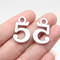 Silver alloy number 5 charms for DIY jewelry making shown on finger for scale - Antique Silver Number 5 (B18260)