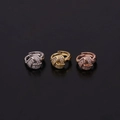 Detail of three hoop earrings in silver, gold, and rose gold with pavé cubic zirconia studs - Crisscross Knot Style (HS251)