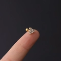 Macro view of tiny gold stud earring with hexagonal cubic zirconia cluster and ball back - 1.2x6mm / No. 2 Gold