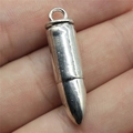 Polished silver alloy 3D bullet pendant with round ring bail held by fingers - Antique Silver