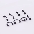 Detail view of 8-piece black stainless steel body piercing set including horseshoe and labret studs - 8 Pieces/Set / Black