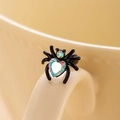 Black spider stud earring with iridescent heart zircon on a beige porcelain cup - Single Piece / AB Colorful (Single Piece)