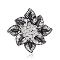 Detailed view of a vintage hollow flower brooch with silver petals and clear crystals - Silver White