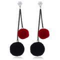 Detail of elegant long chain earrings with plush red and black pom-poms and crystal stud - Red Rope Black