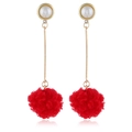 Detail showing long drop earrings with white pearls and bright red furry pom-pom pendants - KC Gold-Red