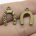 Pair of antique bronze horseshoe charms with Good Luck engraving for DIY jewelry - Antique Bronze