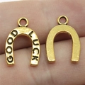 Pair of gold horseshoe pendants engraved with GOOD LUCK for DIY jewelry making - Antique Gold