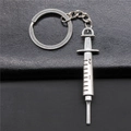 Vintage zinc alloy medical syringe keychain with engraved scale and matte finish - Antique Silver