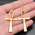 Golden Ankh cross earrings in vintage Egyptian style shown on hand for size - Gold